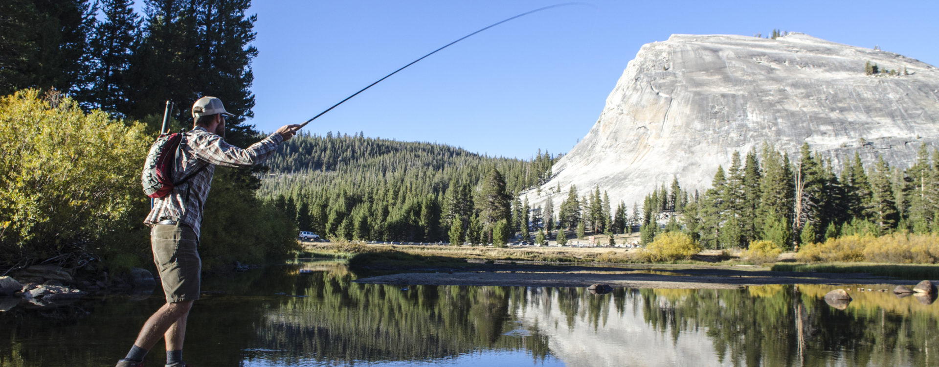 A young man fly-fishes in Tuolumne Meadows, California.
